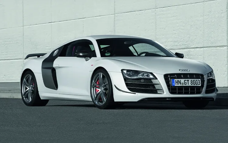 Front three-quarter view of a 2012 Audi R8 GT, an iconic daily-drivable supercar available for under $100k.