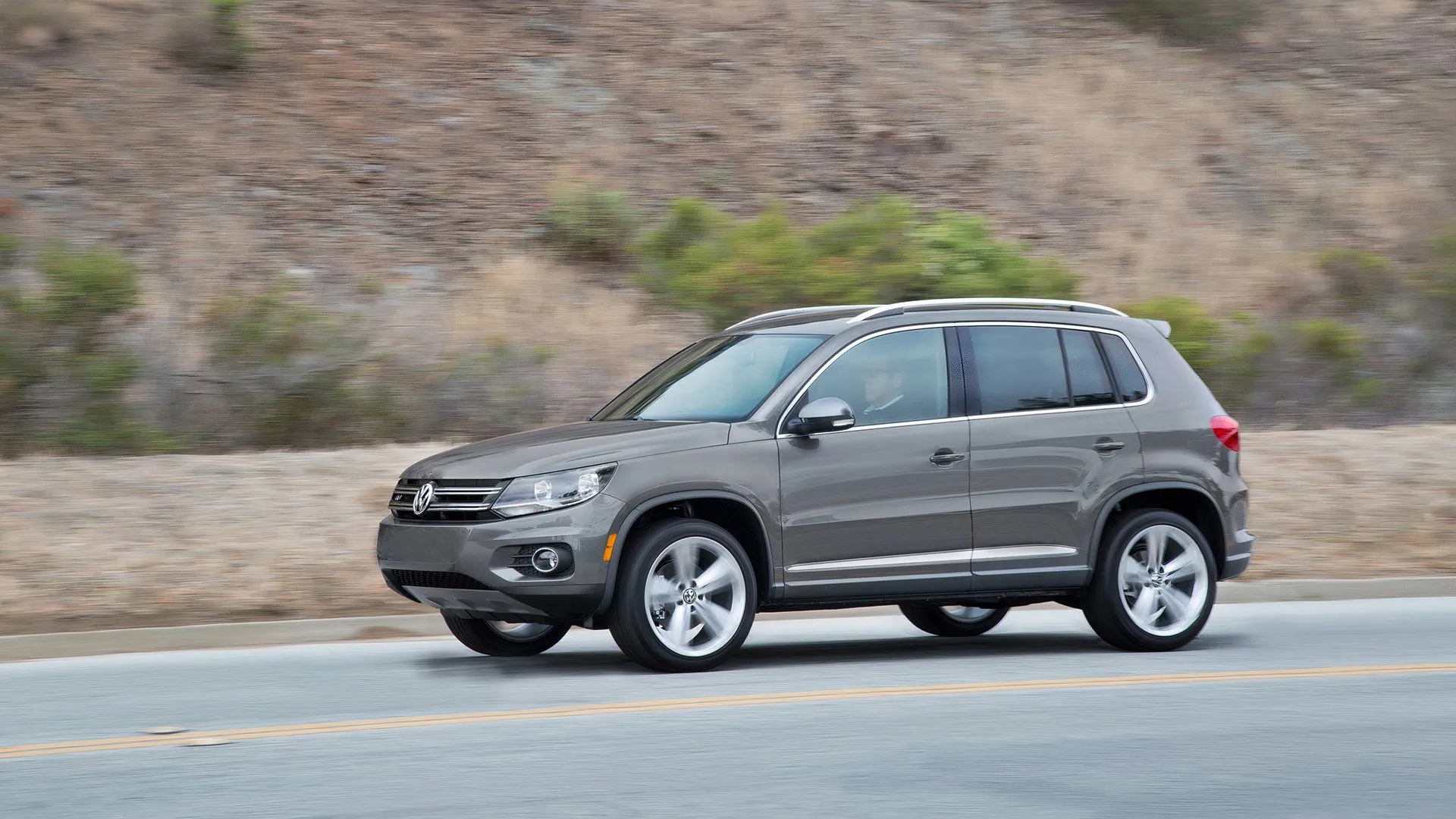 Grey 2016 Volkswagen Tiguan driving 