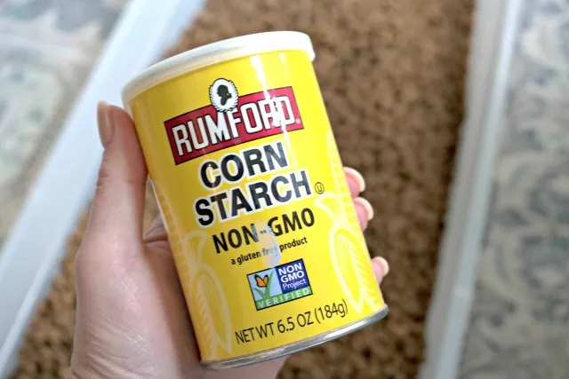 Hand holding corn starch