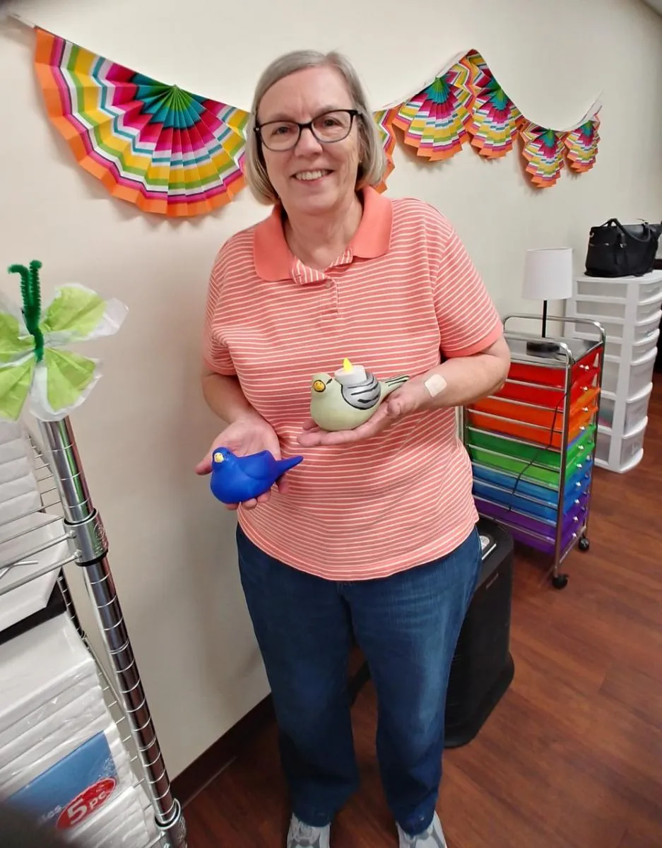 Handcrafted bird artwork created during an arts and crafts session