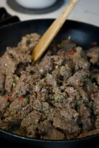 Homemade dog food being portioned into freezer bags