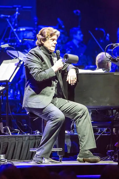 Jerry Schilling, Elvis Presley's close friend, serving as Master of Ceremonies on stage at 'The Wonder Of You' concert