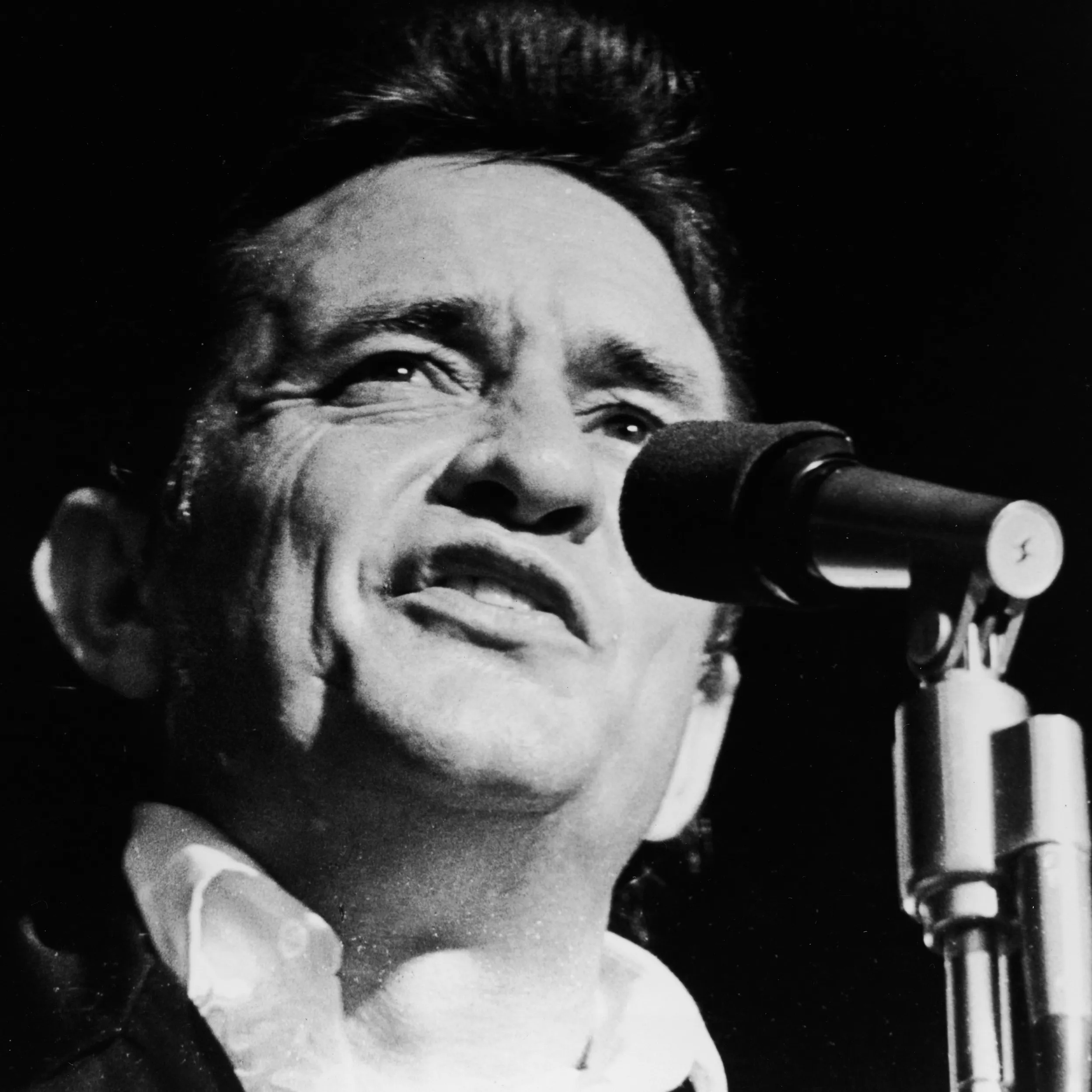 Johnny Cash during his legendary 1968 Folsom Prison concert, taking a stand for the marginalized.