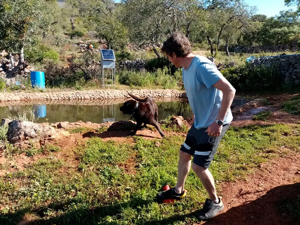Lee aiming the Nerf Dog Stomp Launcher towards the water