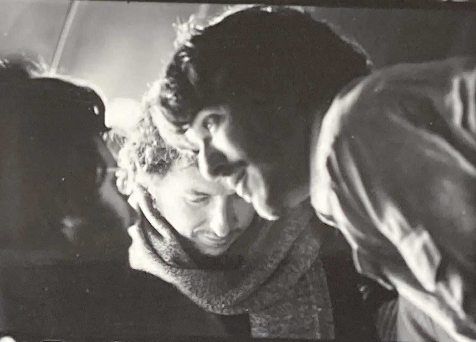 Levon Helm, Bob Dylan, and Rick Danko performing live on stage during the 1974 tour, showcasing the dynamic interplay of Dylan and The Band.