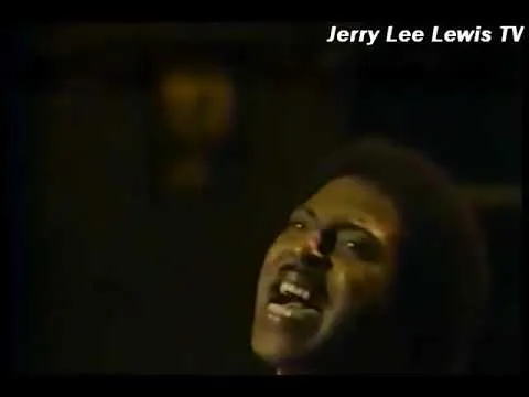 Little Richard performing on stage, showcasing his flamboyant style