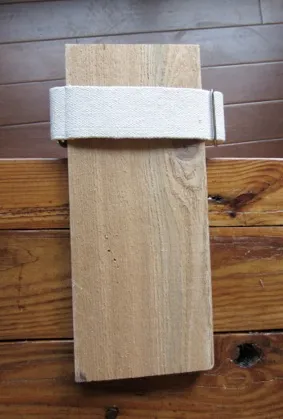 Load the hemp dog collar on a board or book