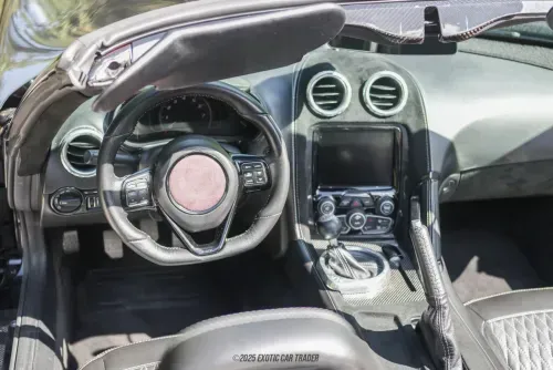 Luxurious interior of the VLF Force 1 convertible, featuring leather, Alcantara, carbon fiber accents, and a modern digital display.