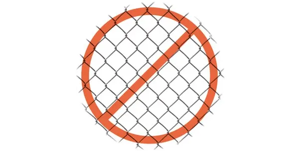 Metal fence showing signs of dog chewing, a dangerous habit that can cause severe dental damage