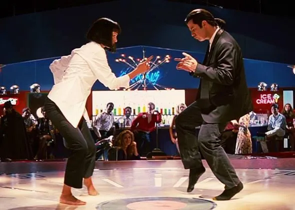 Mia Wallace and Vincent Vega perform their famous twist dance during the iconic contest scene in Quentin Tarantino's Pulp Fiction.