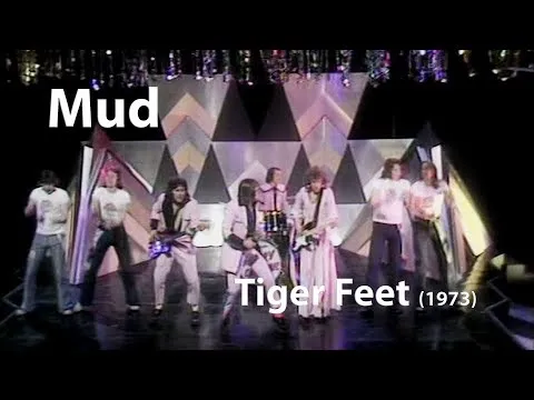 Mud band performing Tiger Feet in 1973, showcasing their glam rock style and energy
