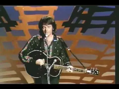 Neil Diamond performing on stage