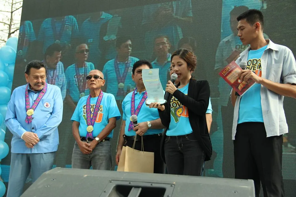 Reading the citation of the plaque of recognition/appreciation for Hon. 
