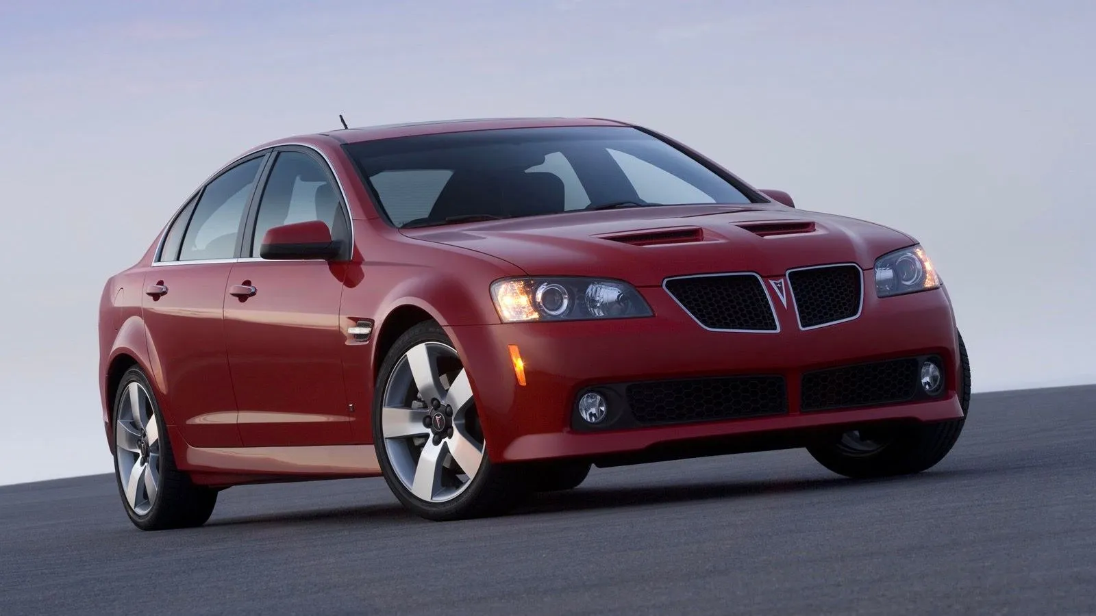 Red 2008 Pontiac G8 GT front three-quarter view parked