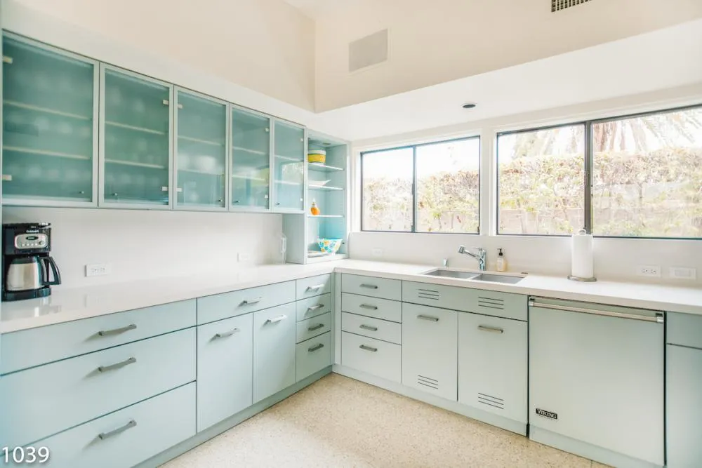 Restored vintage kitchen at the Twin Palms Frank Sinatra Estate, featuring classic St. Charles cabinetry and modern Viking appliances.