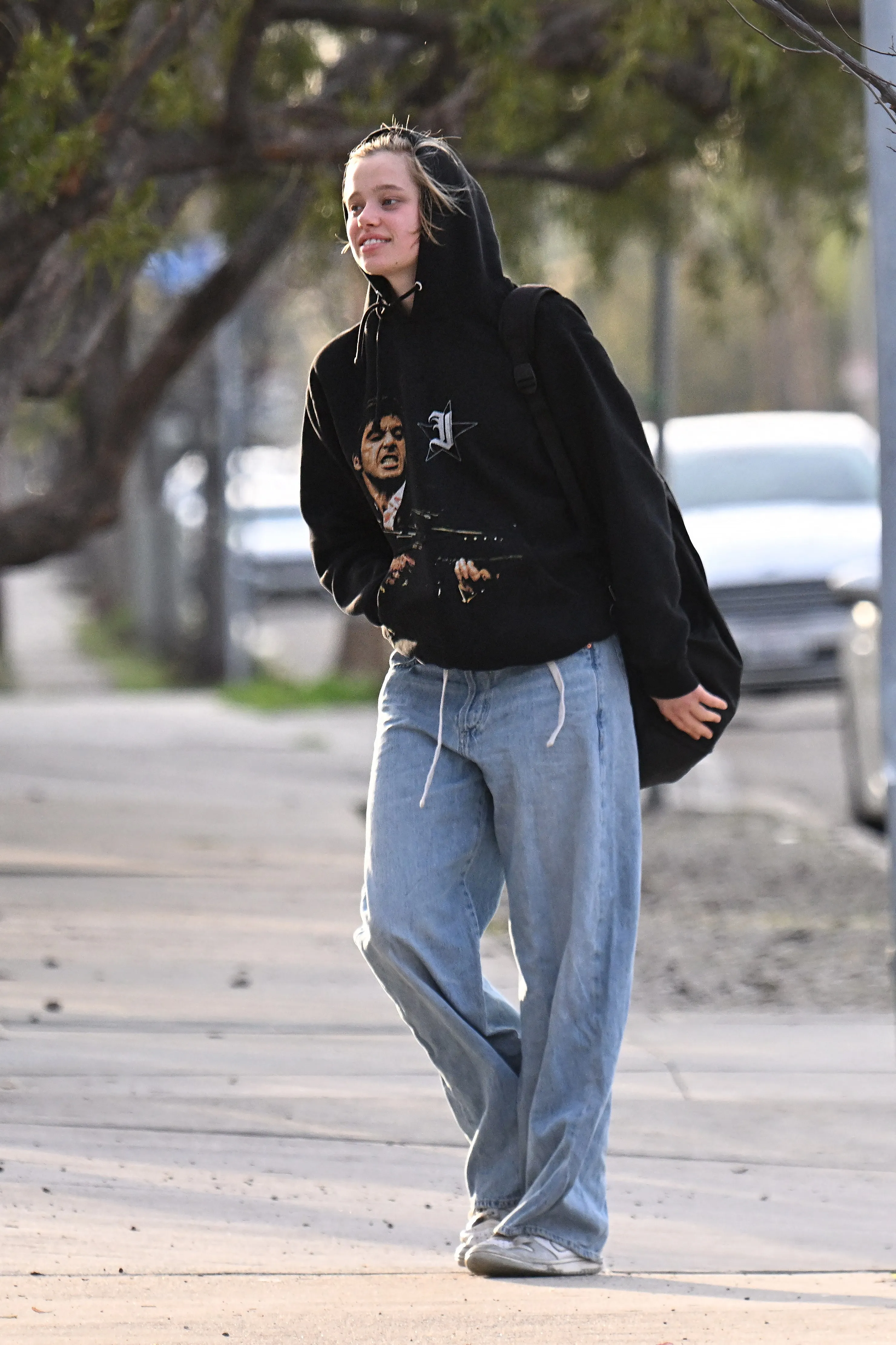 Shiloh in baggy jeans, heading to her dance session.