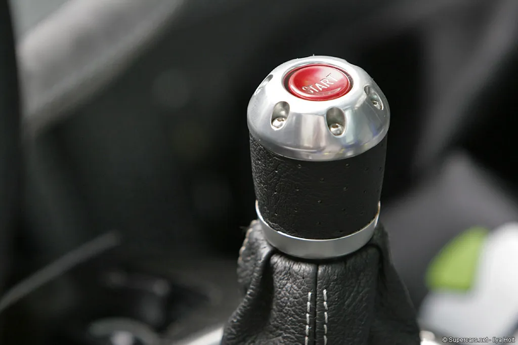 Side view of the 1999 Pagani Zonda C12-S, emphasizing its flowing design and lightweight carbon fiber bodywork.
