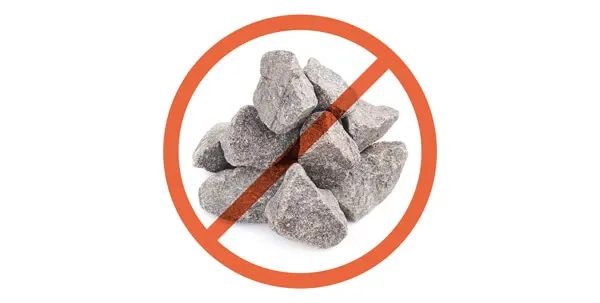 Small river rocks, highlighting dangerous items dogs might chew on, risking tooth damage or blockages.
