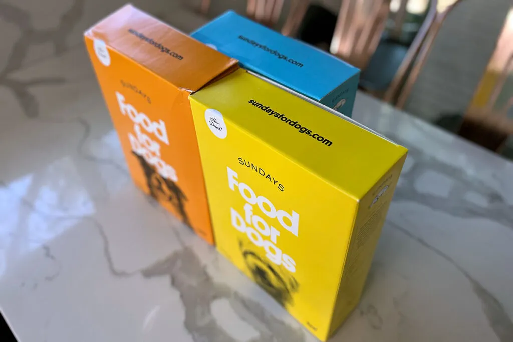 Sundays For Dogs air-dried dog food boxes ready for delivery, highlighting easy purchase.