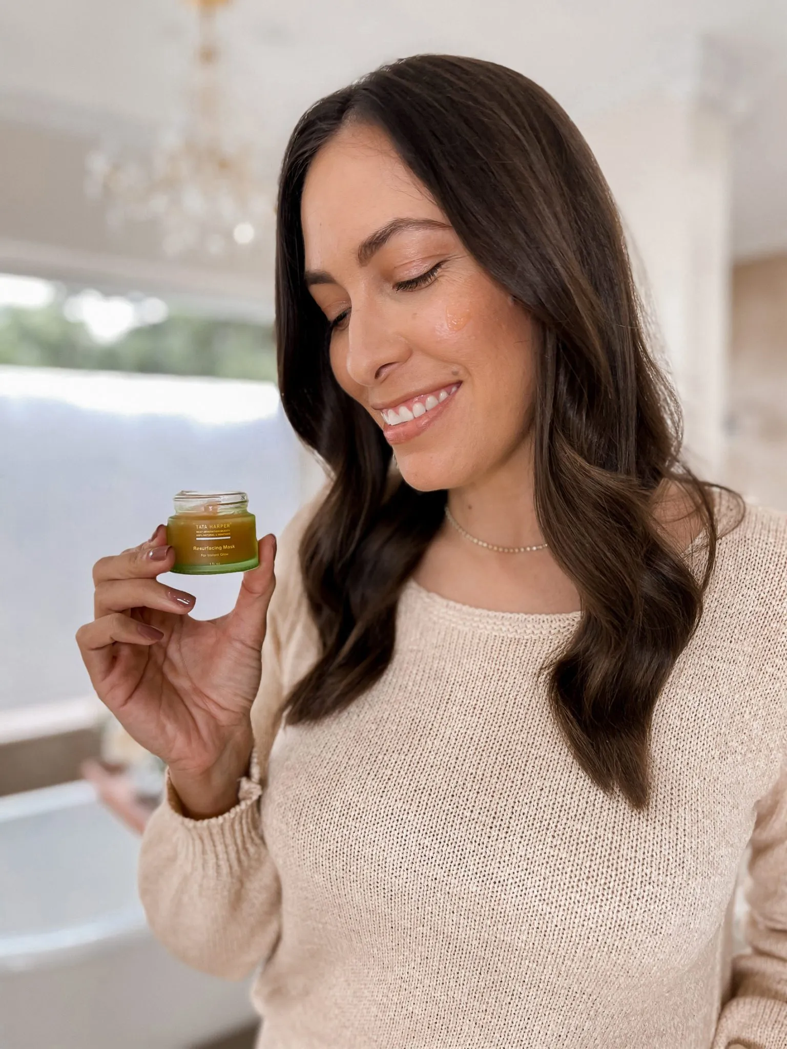 Tata Harper Resurfacing Mask jar on a white surface, embodying a clean beauty lifestyle
