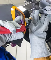 Technician checking welding equipment before a training session