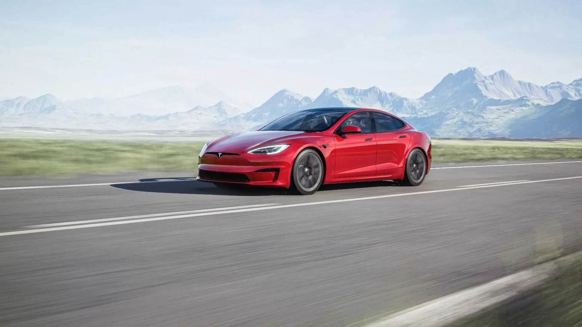 Tesla Model S Plaid interior with yoke steering wheel and large touchscreen