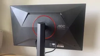 The AOC Gaming Q27G4ZR monitor displaying a graphic design project, showcasing its color capabilities for creative work
