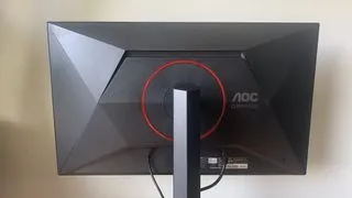 The AOC Gaming Q27G4ZR monitor with its stand fully extended, demonstrating its height adjustability for ergonomic use