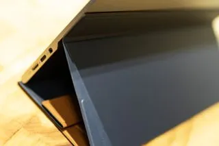 The ASUS ZenScreen MQ16AH portable monitor in use, showcasing its vibrant OLED display for creative tasks