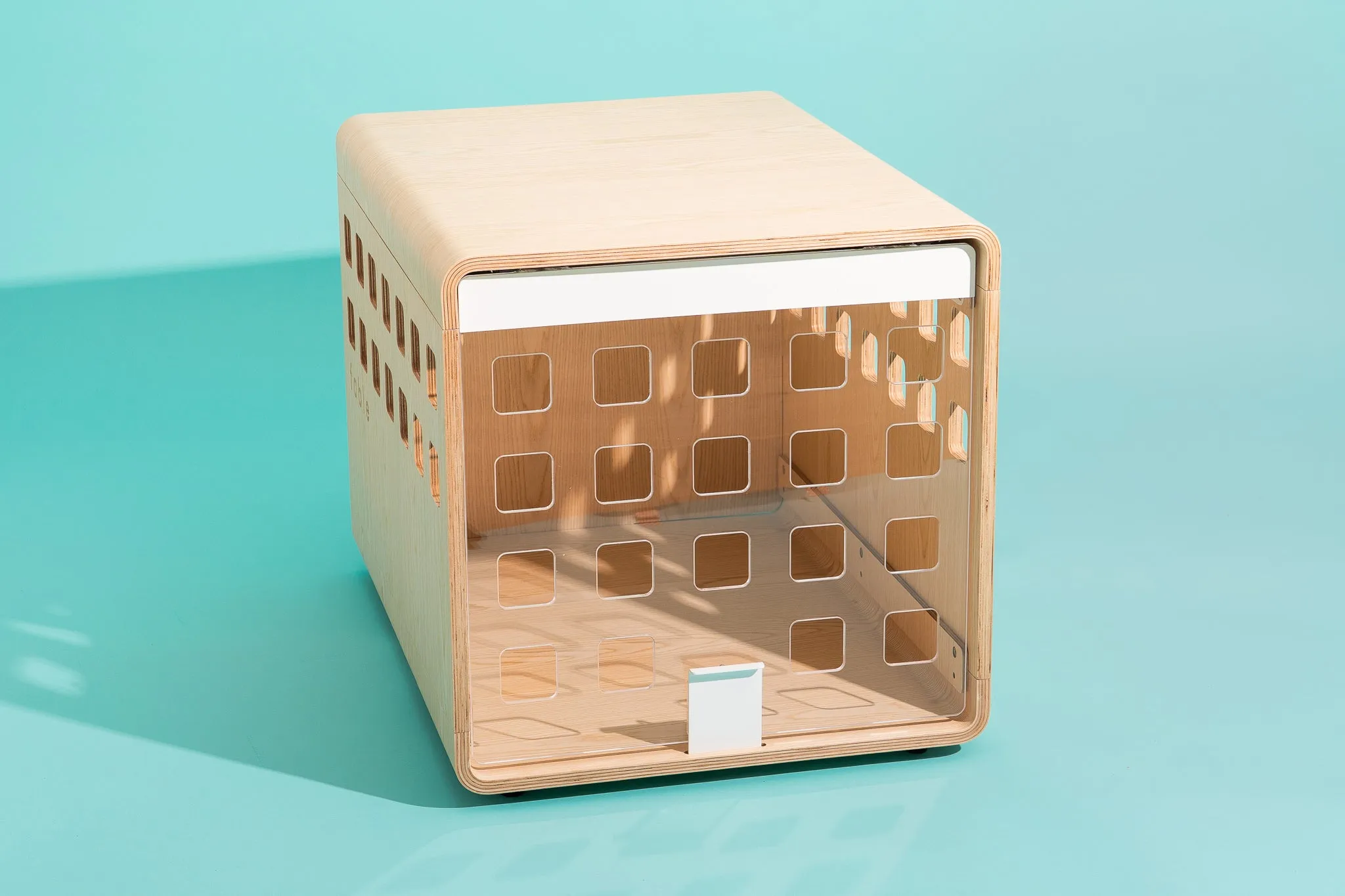 The Fable Crate, shown empty with its clear door shut.