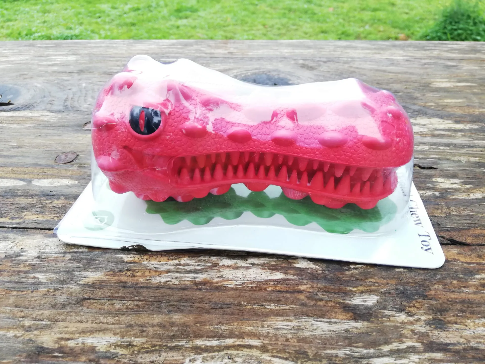 The Hetoo Dental Cleaning Toy, a red, uniquely shaped chew toy