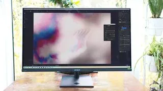The HP Omen Transcend 32 OLED monitor showcasing its minimalist design and large 32-inch screen on a desk