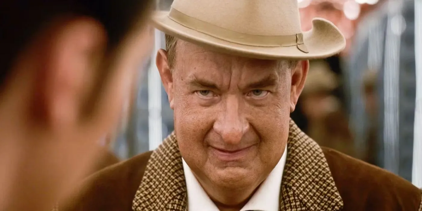 Tom Hanks as Col Tom Parker looking evil in Elvis.