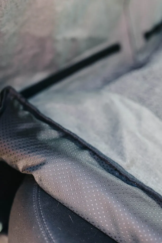 Underside view of the DGS Pet dog car seat cover, showing the non-slip rubber bottom designed to grip car upholstery.