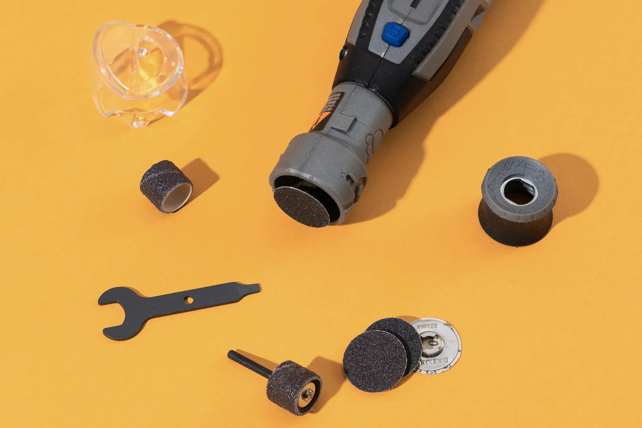 Variety of Dremel PawControl dog nail grinder attachments including sanding disks and bands for different grooming needs.