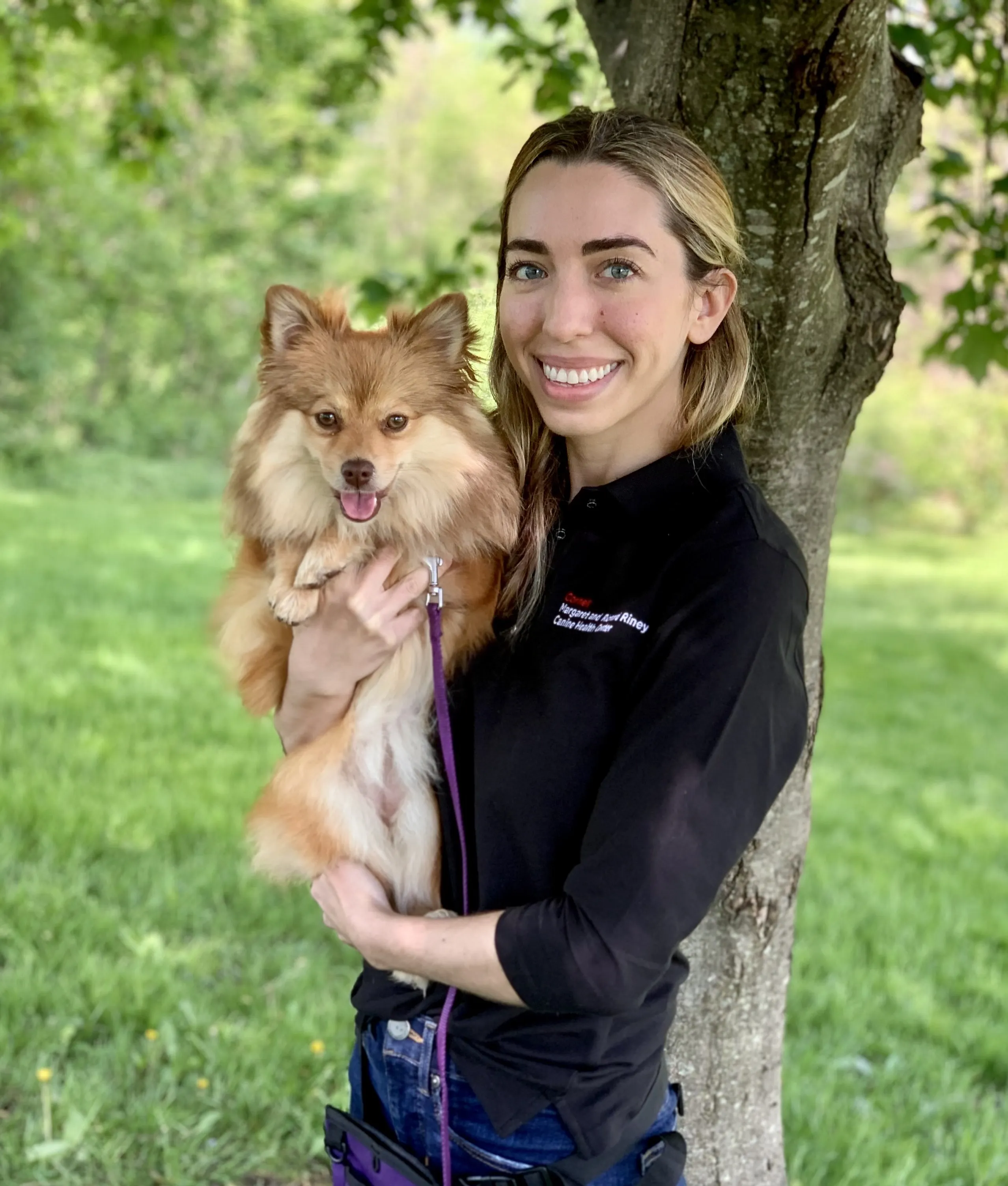 veterinarian Aly Cohen with her fluffy Pomeranian Mishka