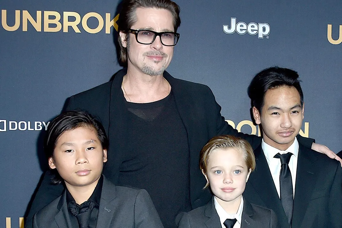 Young Shiloh Jolie-Pitt in a suit, expressing her masculine style with short hair