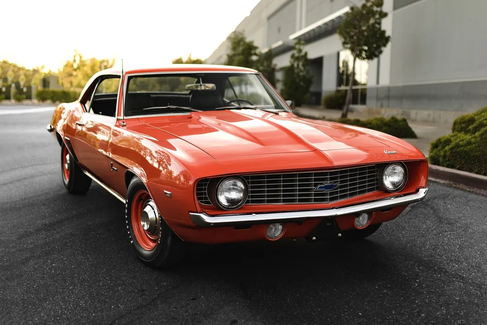 1969 Chevy Camaro ZL1 COPO front 3/4 view showcasing its Hugger Orange paint