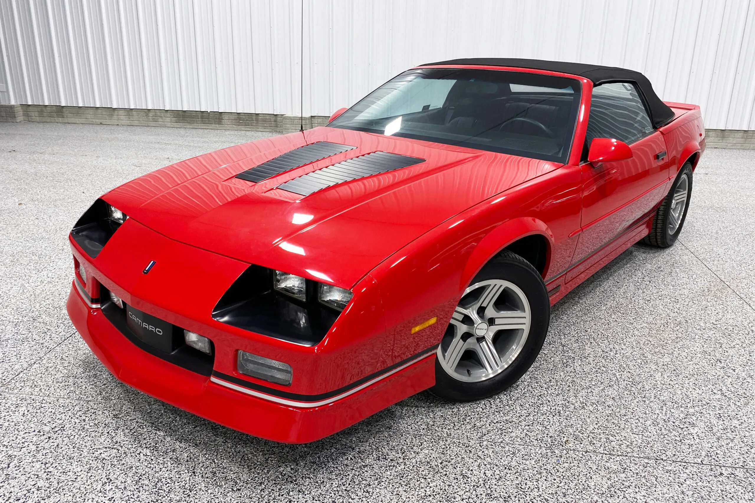 1990 Chevrolet Camaro IROC-Z Convertible in bright red with a black soft top