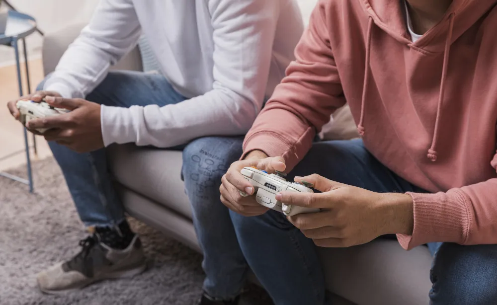 2 guys playing a video game