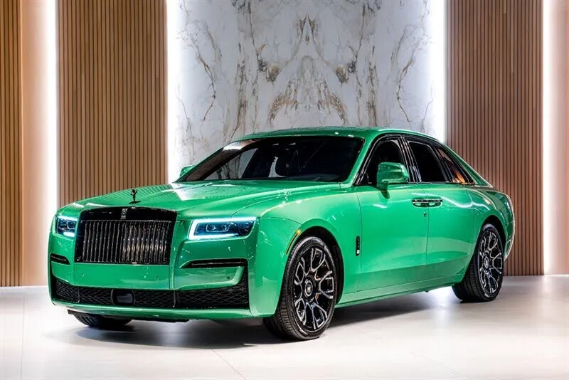 A 2022 Rolls-Royce Ghost Black Badge AWD in Crystal over Fame Green, highlighting a unique color option