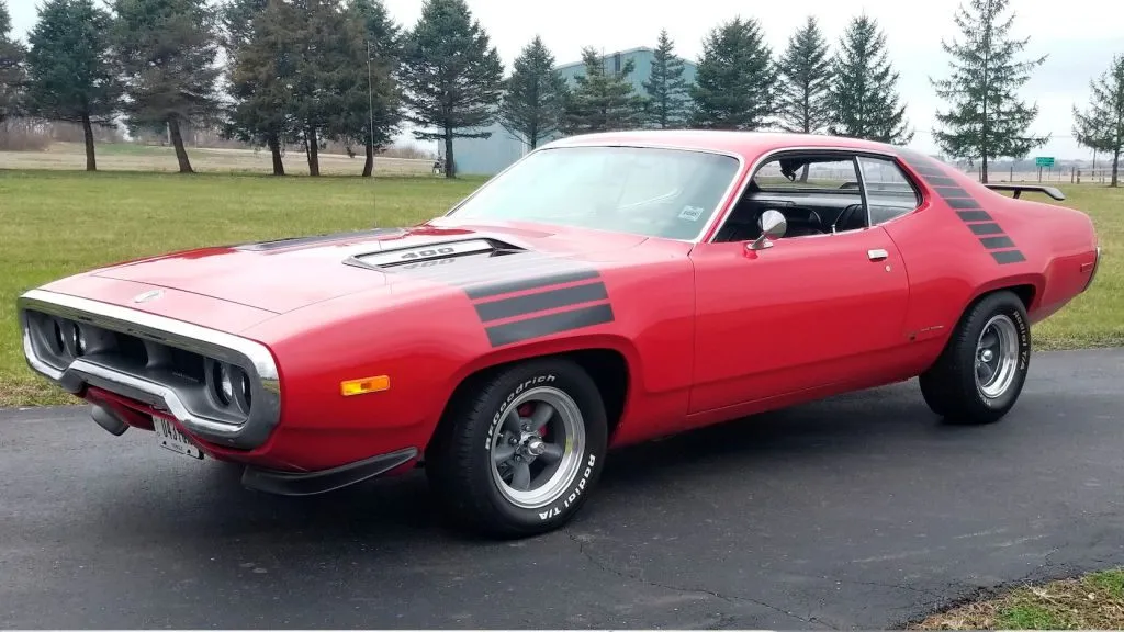 A bright yellow 1972 Plymouth Roadrunner with black accents