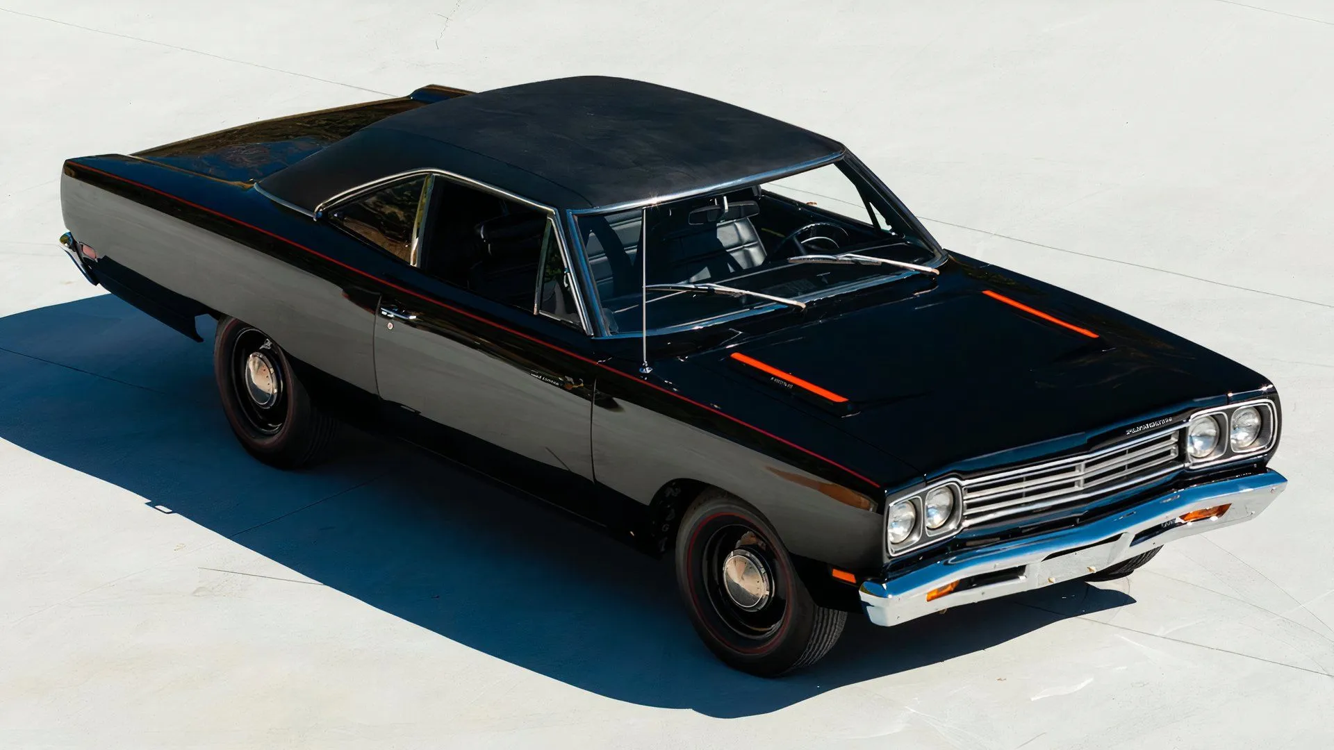 A classic 1969 Plymouth Road Runner in a scenic outdoors setting