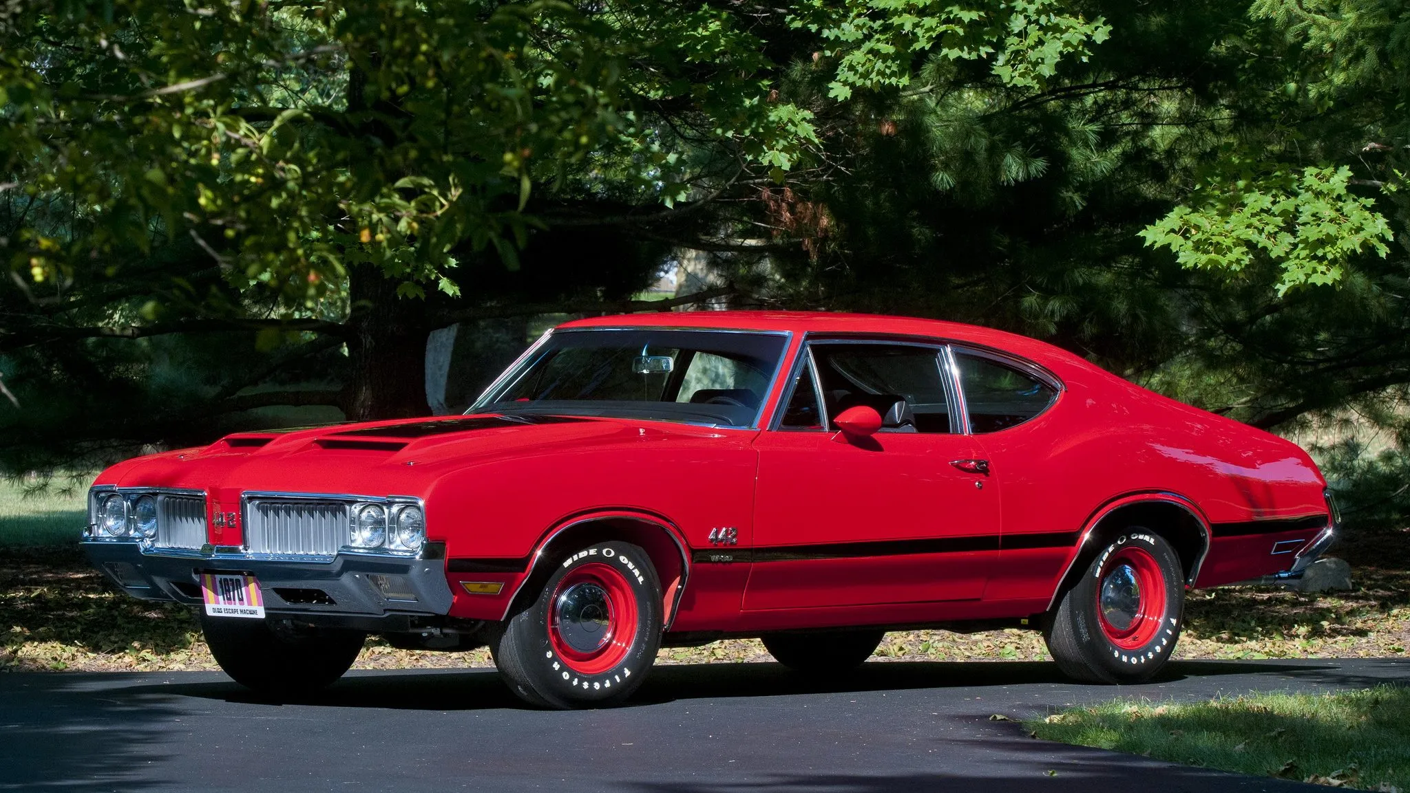A classic 1970 Oldsmobile 442 W-30, highlighting its distinctive styling and powerful presence.