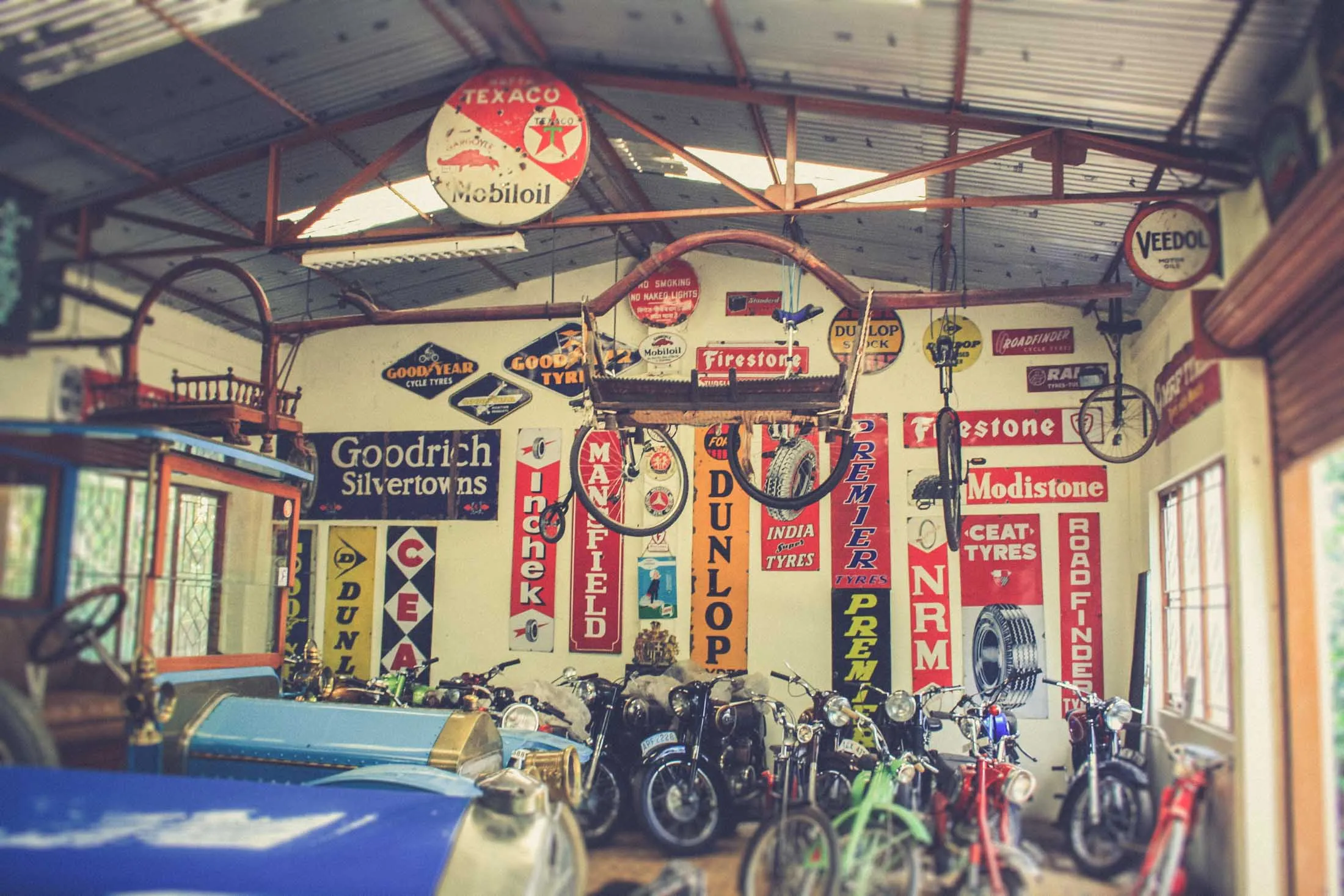 A classic vintage car with intricate detailing, part of a vast collection, showcasing automotive heritage