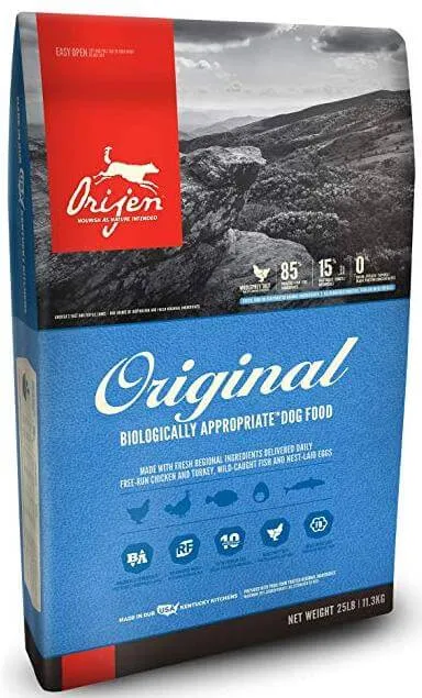 A close-up of Orijen kibble, showcasing its texture and size suitable for small dogs