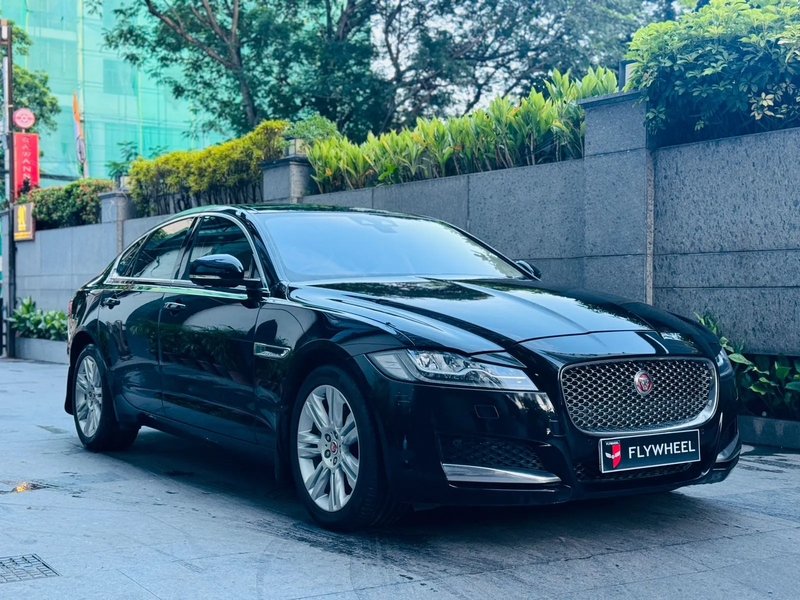 A curated selection of luxury pre-owned cars on display at Flywheel Cars showroom.
