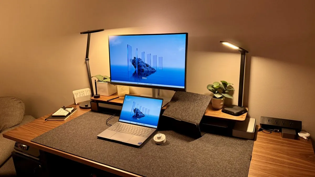 A detailed view of the BenQ PD2730S monitor on a clean white background, showcasing its sleek design and thin bezels