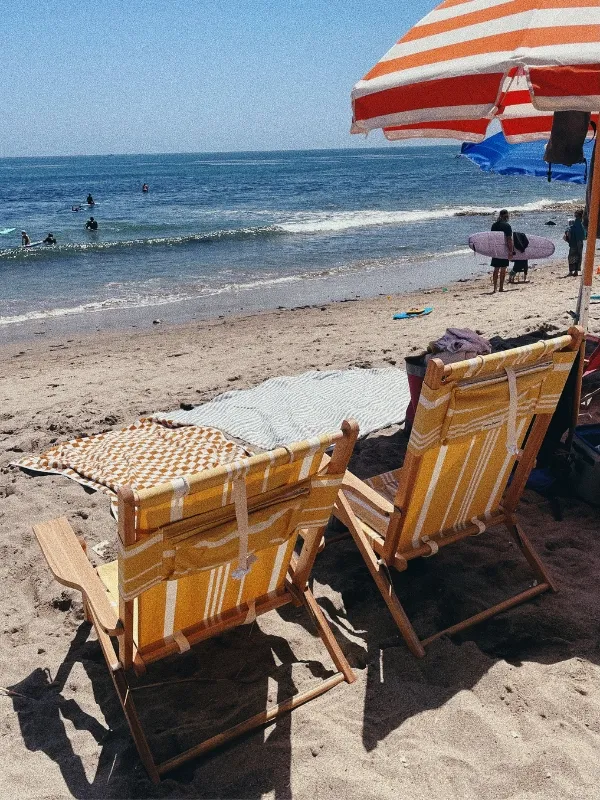 A family enjoying activities on the beach in Malibu.