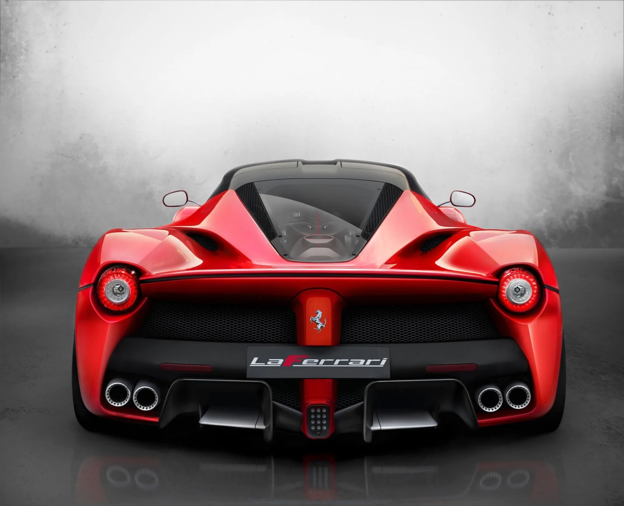 A Ferrari LaFerrari parked on a street.